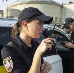 A police officer on her radio.