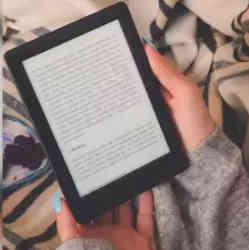 Reading an e-book on a Kindle. 