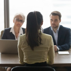 two interviewers face a job candidate