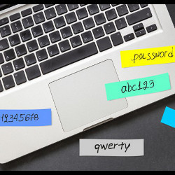 passwords on sticky notes stuck to laptop keyboard