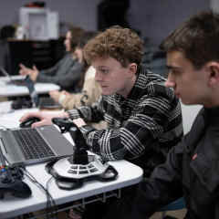 Students attend a robotics class at Mineola High School in Mineola, NY.