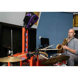 Macquarie University's Richard Savery playing along with Keirzo the drummer robot. 