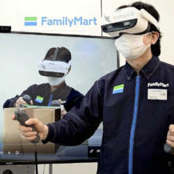 A FamilyMart employee receives virtual reality customer service training.