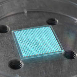 A large scale angle-sensing structure comprising nanocrystal phospors, a key component of the sensor, illuminated under ultraviolet light.