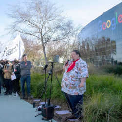Ed Stackhouse speaks at a demonstration in front of Google headquarters.