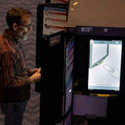 A local resident casts his ballot using a Dominion Voting System machine during the midterm election at the Fox Theater in downtown Atlanta, GA, November 8, 2022. 