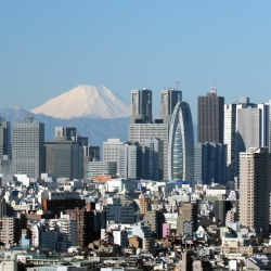 The skyline of Shinjuku, Tokyo, Japan, with a view of Mt. Fuji.