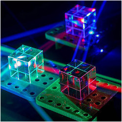 see-through colored cubes on conveyor platforms, illustration