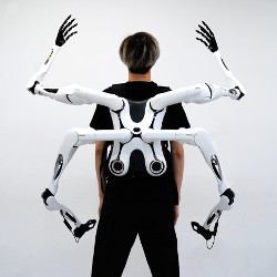 person wearing Jizai robotic arms