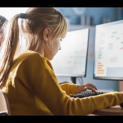 schoolgirl working at a computer