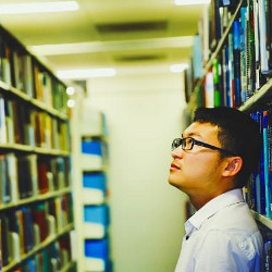 Chinese scientist examines library shelves