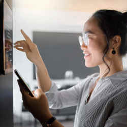 A woman programming her smart house.