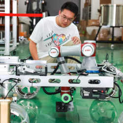 A staff member adjusts a maintenance robot designed for China's Five-hundred-meter Aperture Spherical Radio Telescope (FAST) in southwest China's Guizhou Province.