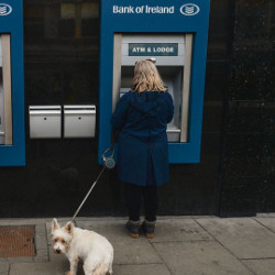 person at a Bank of Ireland ATM in Dublin