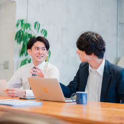 two office workers conversing