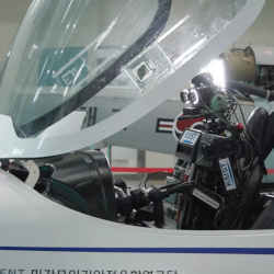 The Pibot robot at the controls of an aircraft.