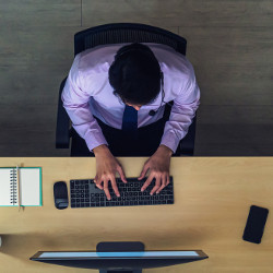 office worker typing on a keyboard