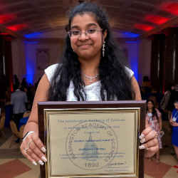 Archishma Marrapu displays the Washington Academy of Science's 2023 Student Achievement Award she received earlier this year.