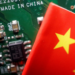 China flag next to a printed circuit board marked 'Made In China'