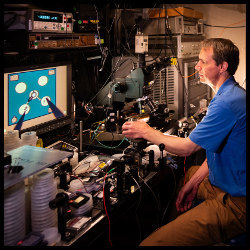 Sandia's Darwin Serkland observes a laser diode under a microscope 