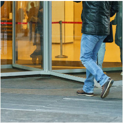 workers entering a building's revolving door