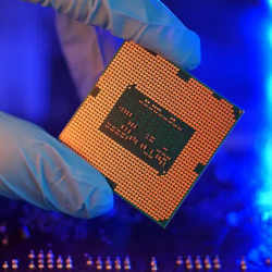 Worker holding a semiconductor. 