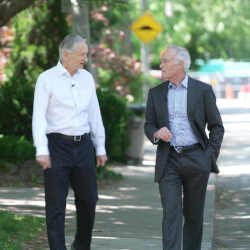 Hinton walking with 60 Minutes interviewer Scott Pelley.