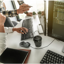 two programmers working at an office computer