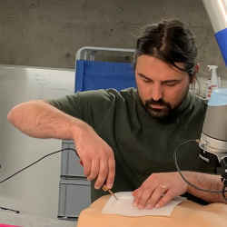 Arturas Straizys from the University of Edinburgh's School of Informatics demonstrates the smart scalpel in the lab.