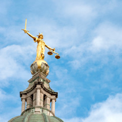 statue atop the Central Criminal Court of England and Wales