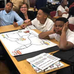 School District of Philadelphia CIO Melanie S. Harris with Rowen Elementary students 