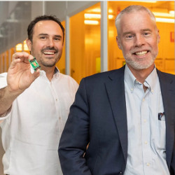 Alvaro Casas Bedoya, holding a photonic chip, with Ben Eggleton at the University of Sydney