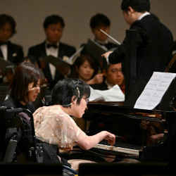 musician with a disability performing at Suntory Hall