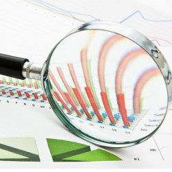 magnifying glass focused on a graph, illustration