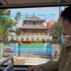 A tourist learns about the sights he sees from the AR Interactive Vehicle Display.