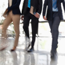 workers walking in an office building