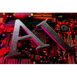 The letters AI (for Artificial Intelligence) on a computer motherboard.