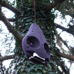 The robot Avocado maneuvers around branches in the treetops.