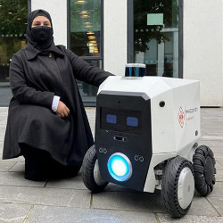 Ebtehal Alotaibi and a Pixie robot outside the Bayes Centre at the University of Edinburgh