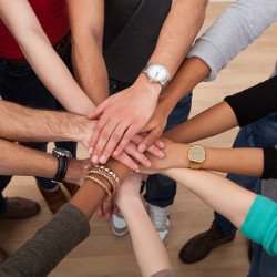 stack of diverse hands