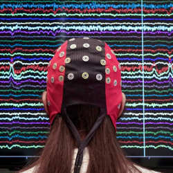 scientists have studied how brain-computer interfaces, such as this non-invasive cap, change brain activity